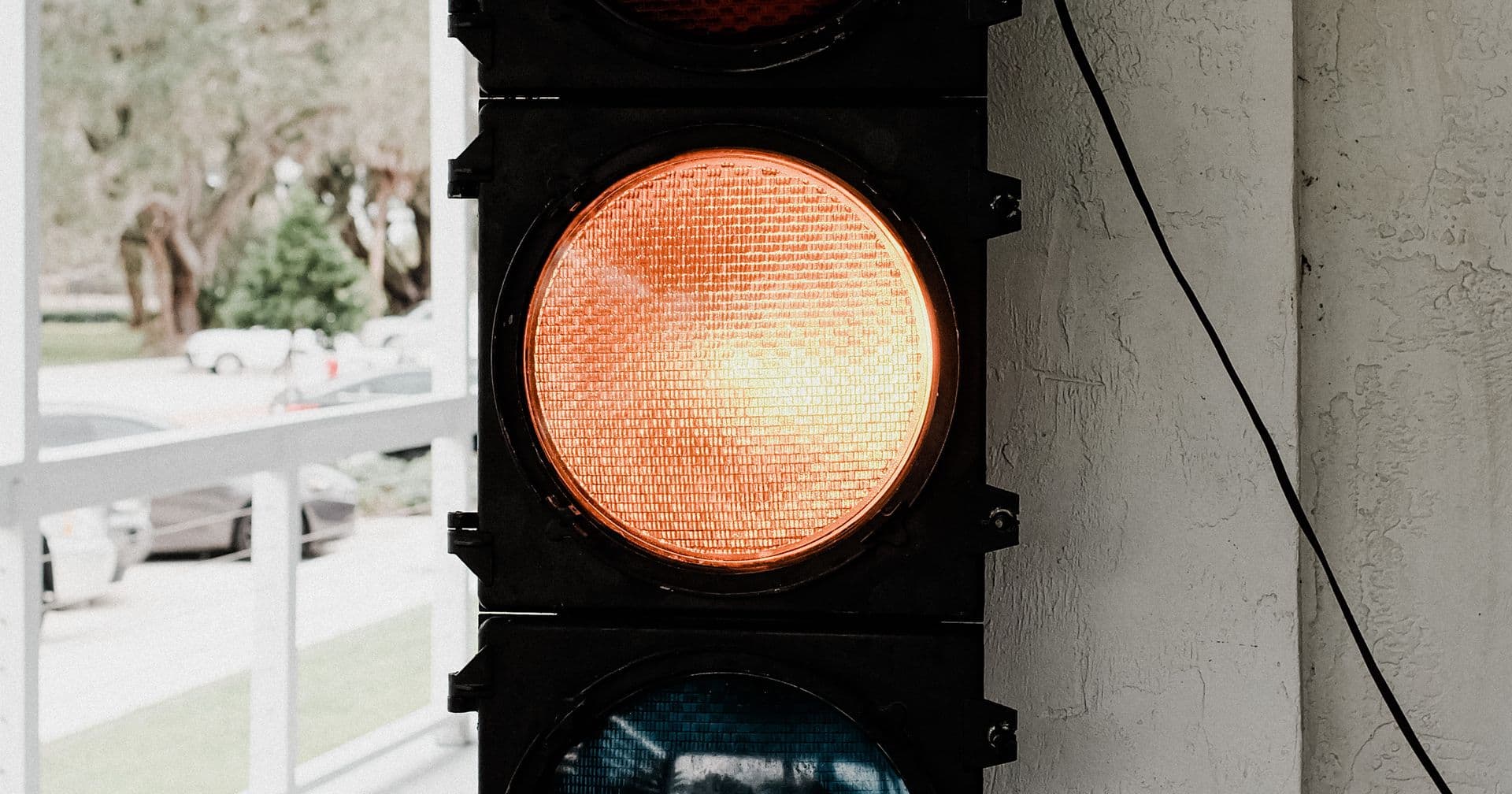 A glowing amber traffic light — like the HTTP status codes (200, 301, 404) every page returns