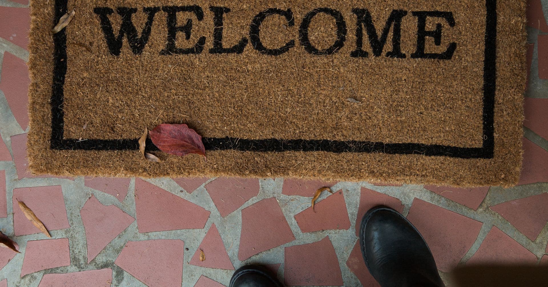 A welcome mat laid out for a robot — like an llms.txt file guiding AI agents to a site’s key pages